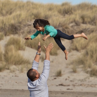 Father Tossing Daughter